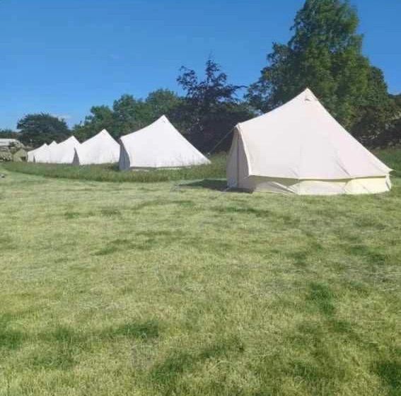 12 fully furnished bell tents 