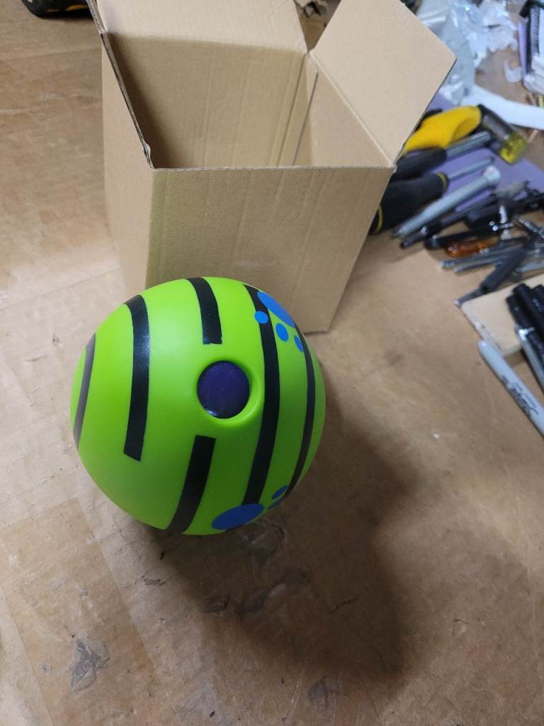 A new still boxed Interactive Giggle Ball for Dog Squeaky Toy Keep Your Dog Happy 