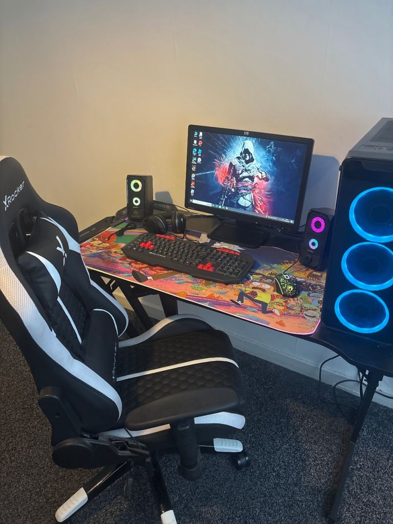 Gaming PC Setup with Monitor, Keyboard, Mouse, and Chair