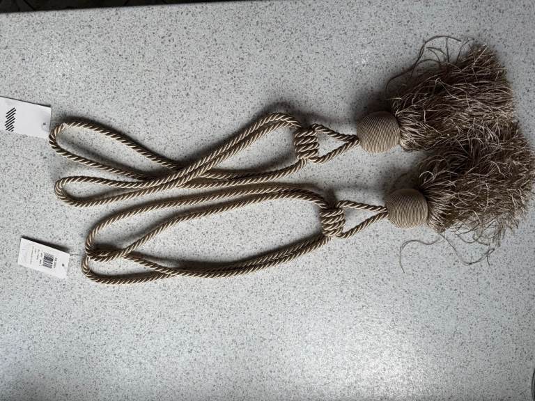 Gold coloured John Lewis curtain tie-backs