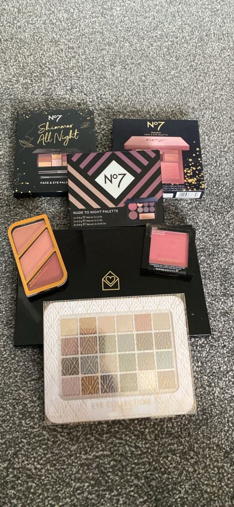 Mixture of brand new unused and sealed makeup.