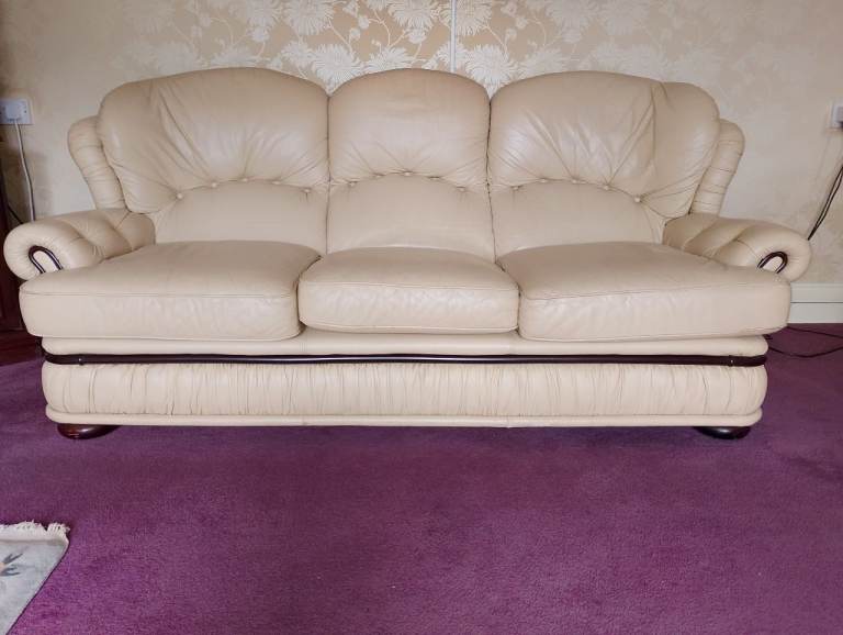 Cream 3 seater sofa.