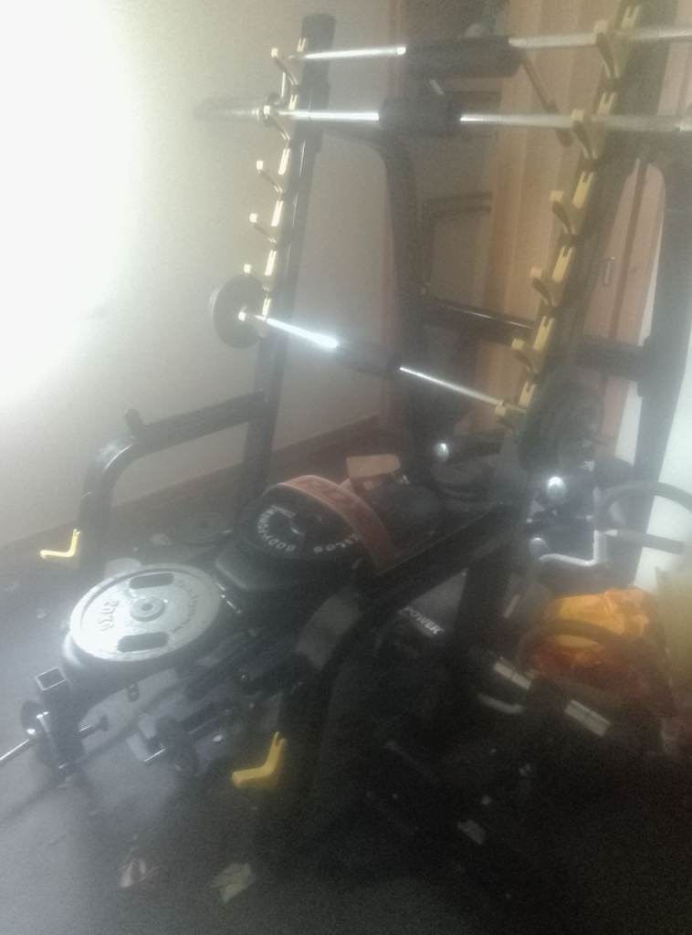 Weight equipment with bars weights bench and squat rack