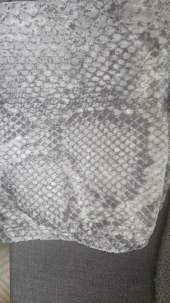 Ad new never used grey snake print blanket 