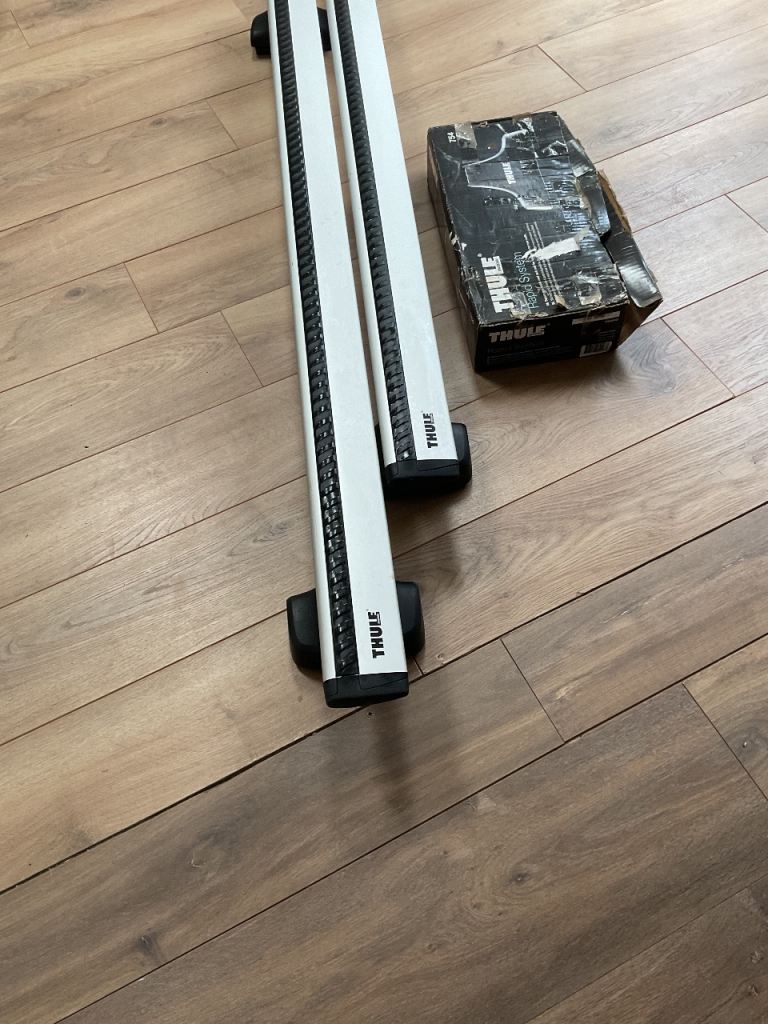 Thule wing bar roof bars with 754 brackets (for roofs with no fix points). 140cm long.