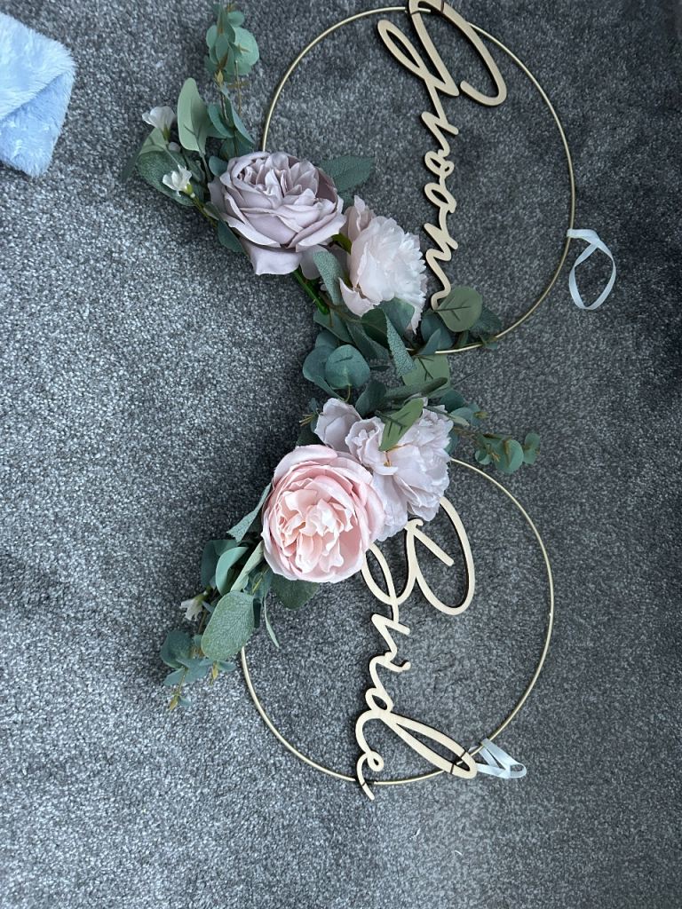 Bride and Groom table/chair wreaths with extra flowers 