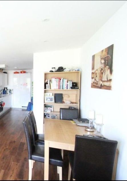 Wooden Dining Table with 3 Black Leather Chairs