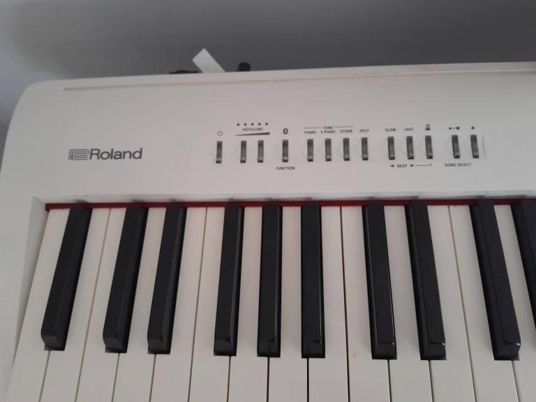 Roland FP-30 digital keyboard.