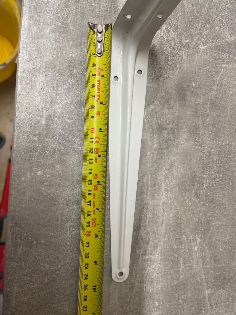 White metal shelf brackets