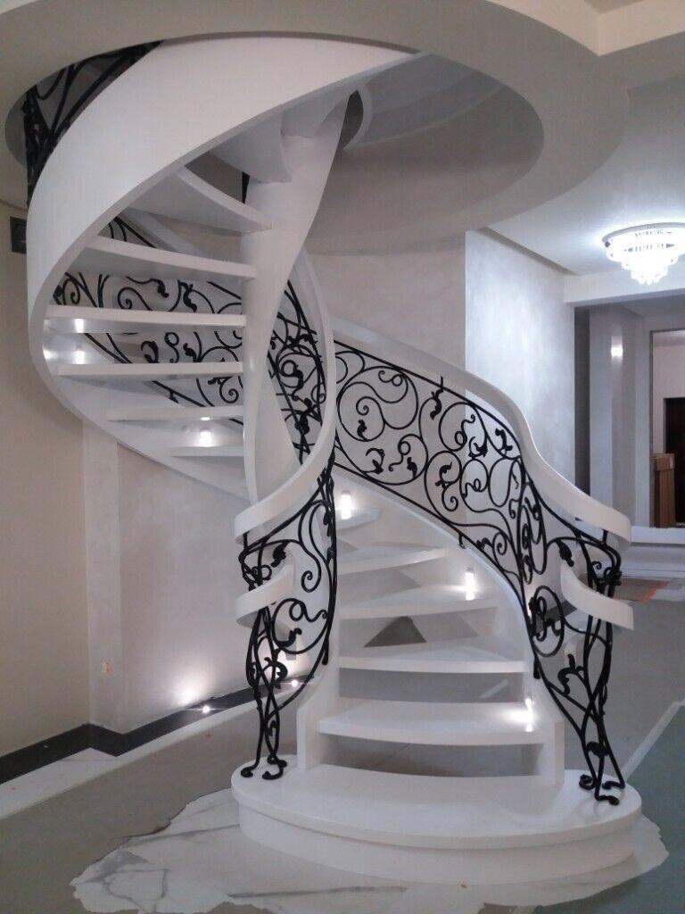Oak exclusive curved stairs helicoidal stairs with iron balustrade UK Ltd