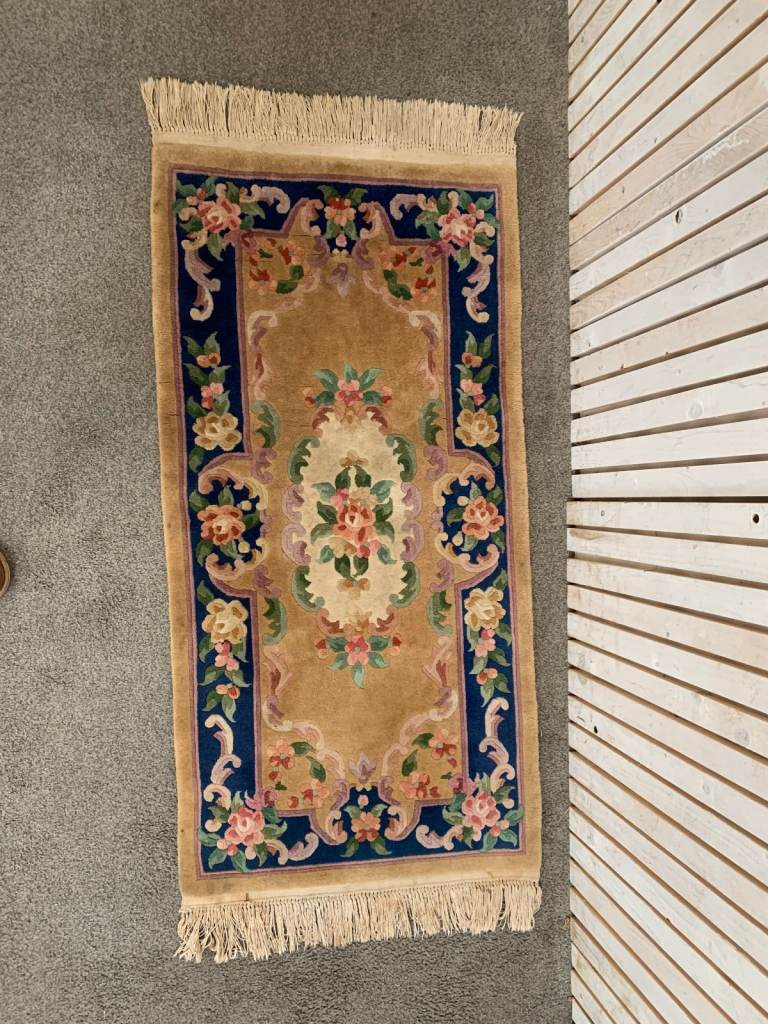 A Chinese Wool Rug of Blue, Rose, Green, Ivory and Camel in a Floral Design