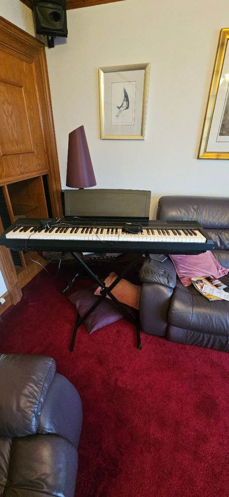 Electronic Keyboard with Stand – Good Condition