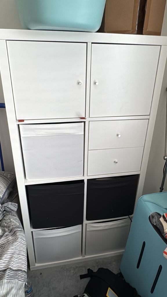 White IKEA Kallax 8-cube storage unit with inserts