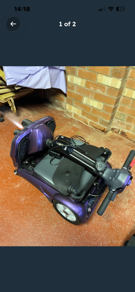 Purple electric mobility scooter