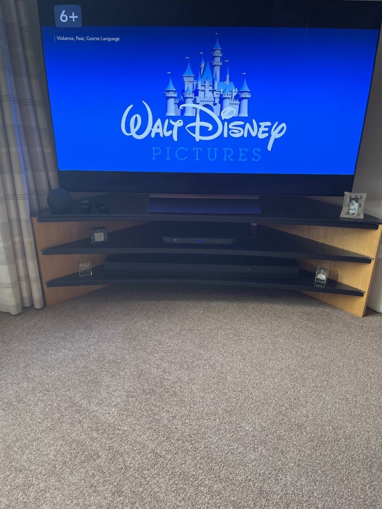 Good Condition Brown Wood and Black Curved TV Stand