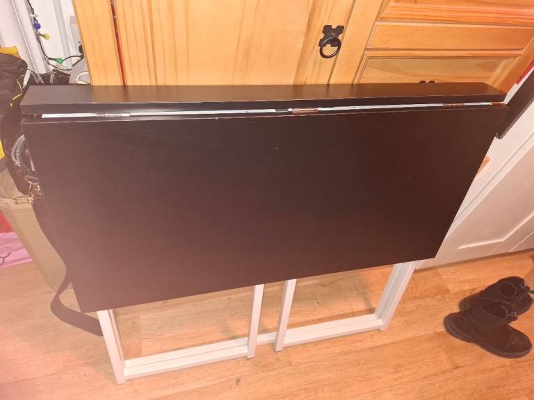 drop-down table  can be wall mounted 