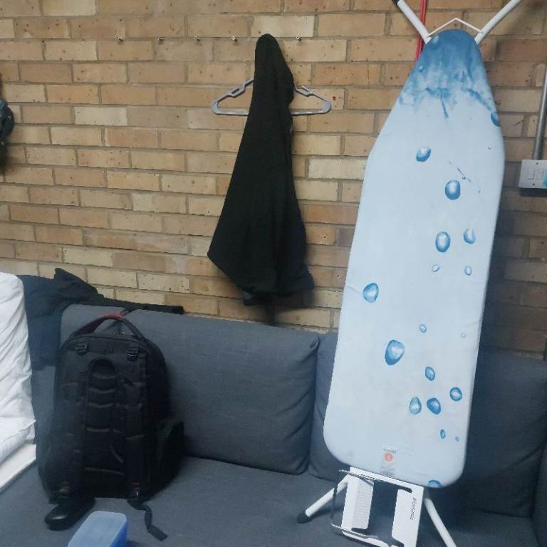 Good Condition Ironing Board with Blue Bubbles Cover
