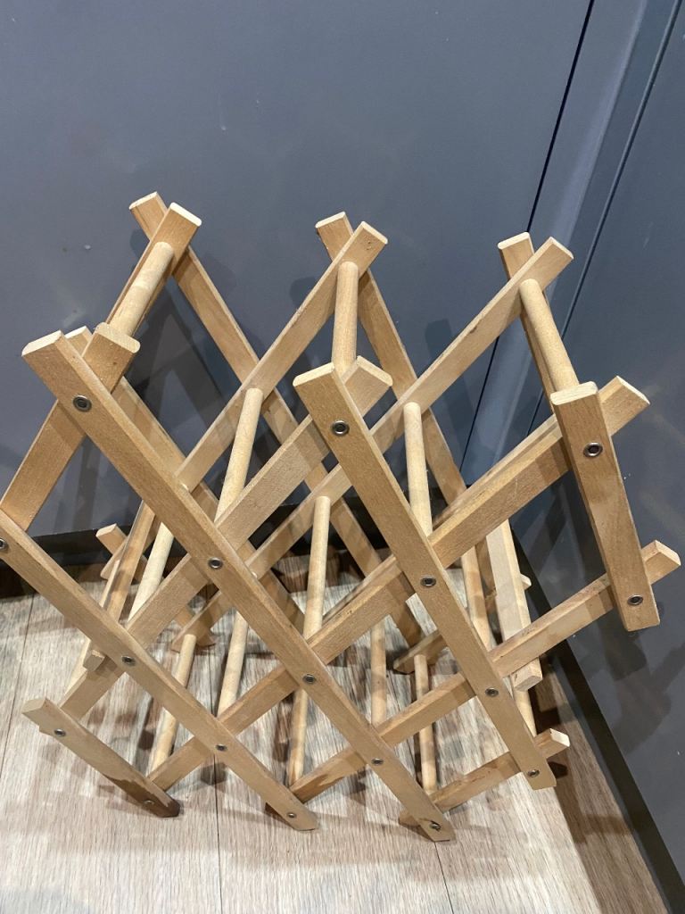 Foldable wooden wine rack used for countertop bottle storage - £3 (Wallisdown)