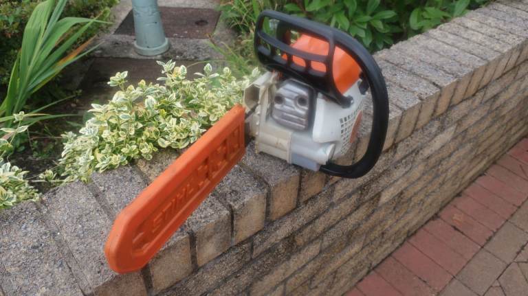 Good Condition STIHL Chainsaw with Bar Cover