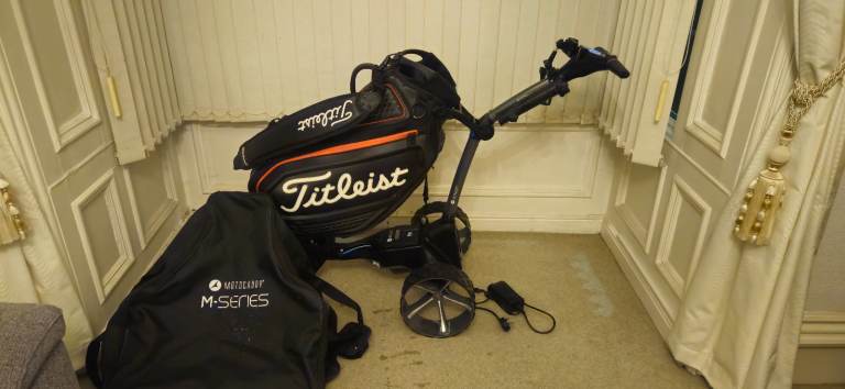 Motocaddy m5 gps golf trolly with titleist tour bag and carry case