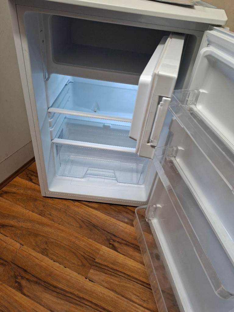  ESSENTIALS,undercunter fridge with small freezer, MODEL:CUR55W19 like new Condition 