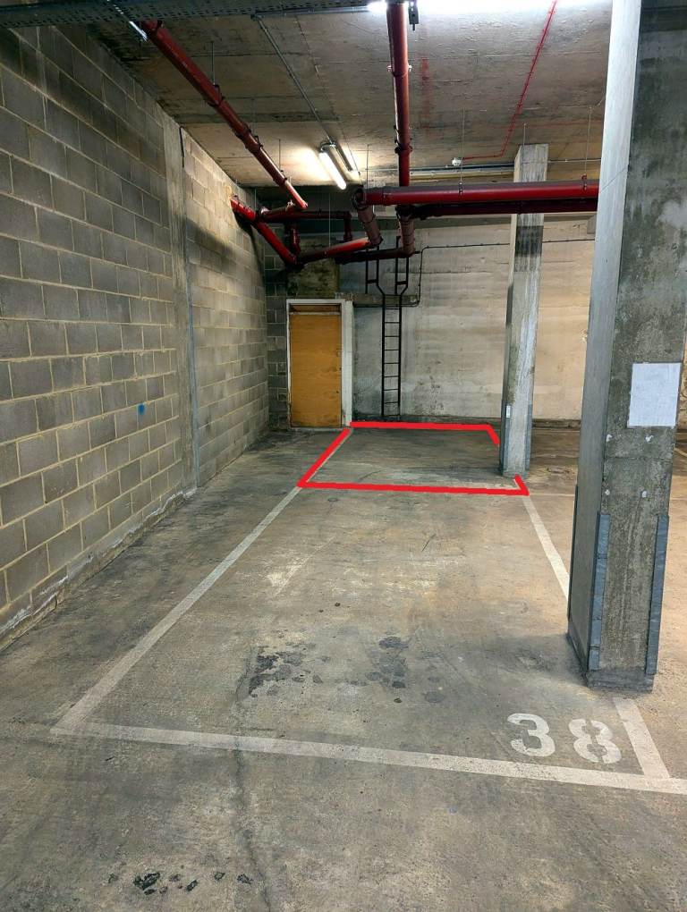 Large Parking Space in Garage Ideal for Storing Cars, Vans, and Motorbikes
