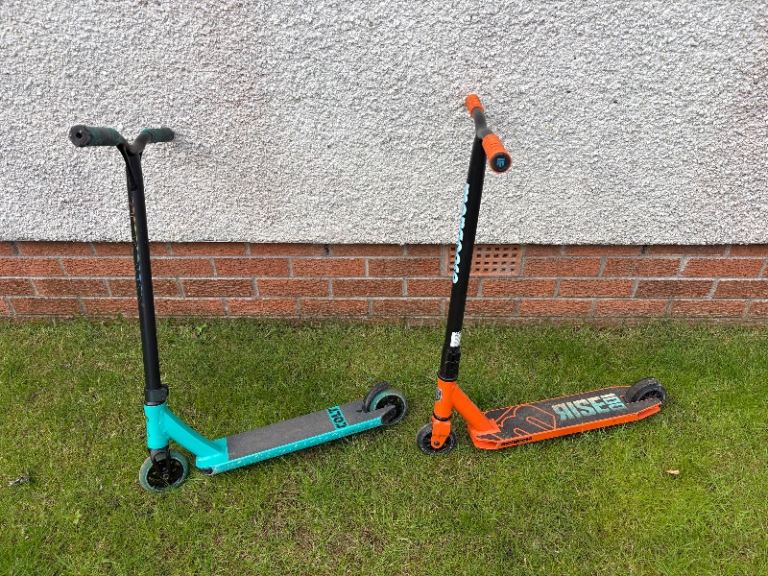Two Stunt Scooters – Orange and Blue, Good Condition