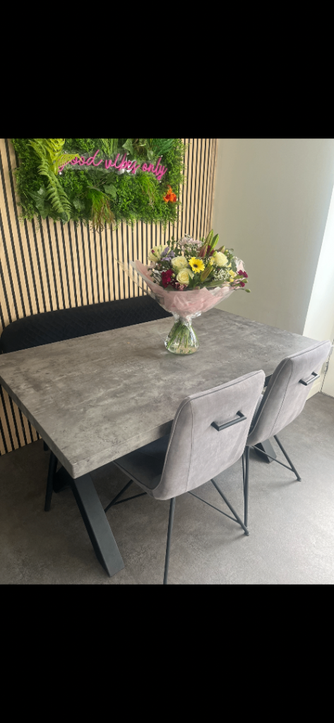Grey concrete dining table, bench and chairs