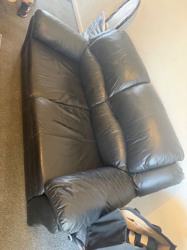 2 Seater and 1 Seater Black Leather Sofas with Glass Coffee Table