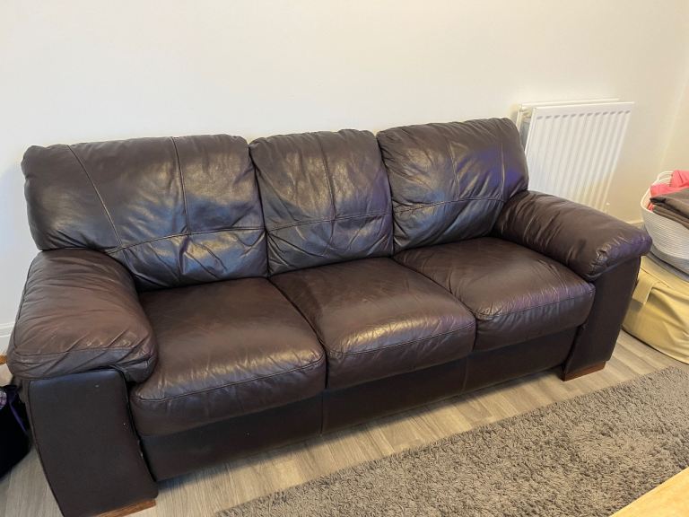 Three seater brown leather sofa