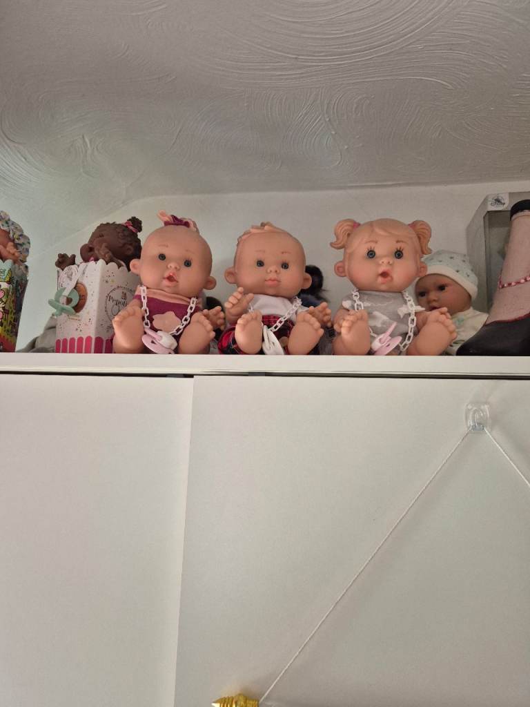 Collection of novelty baby dolls in boxes or with dummys
