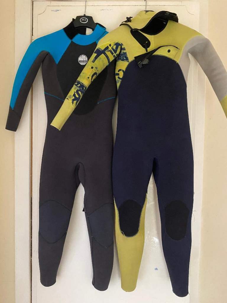 2 junior wetsuits