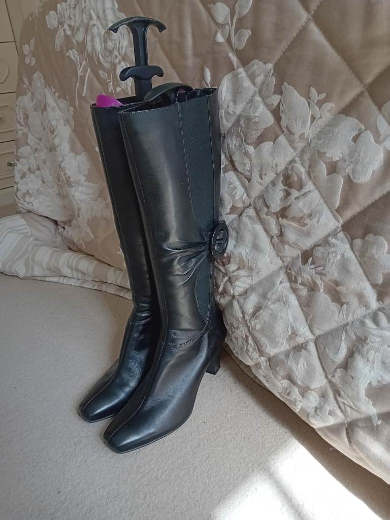 Black leather knee high boots