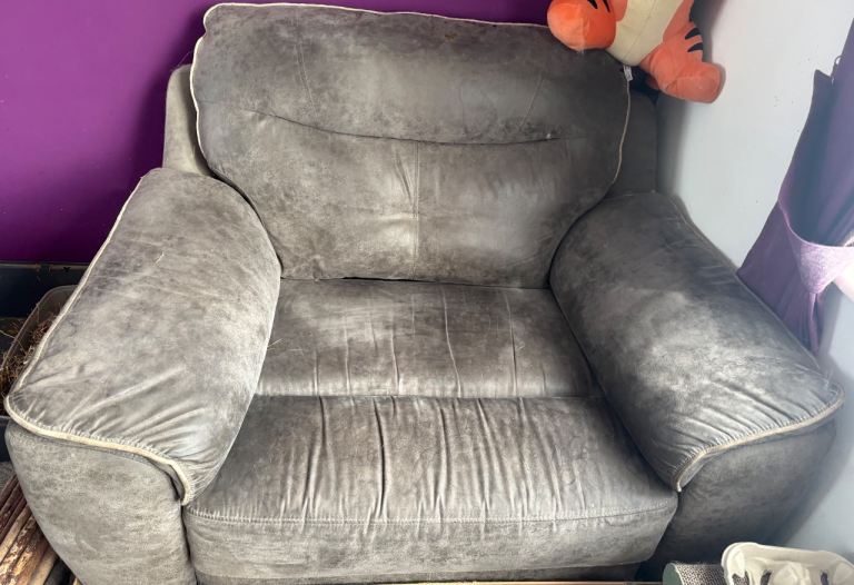 Large brown leather armchair