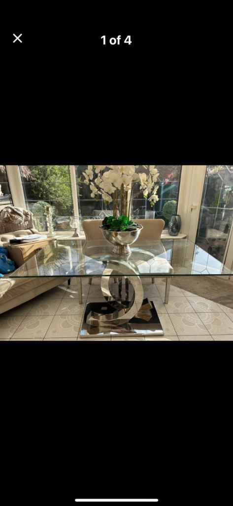 Glass dining room table with silver CC base