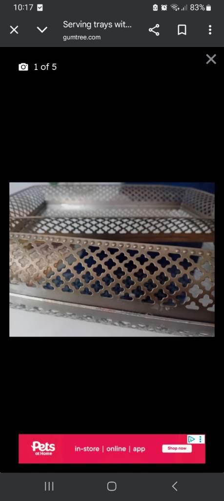 Gold serving trays with a decorative edge and glass