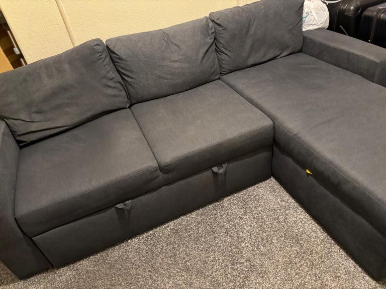 Grey L-shaped sofa bed 