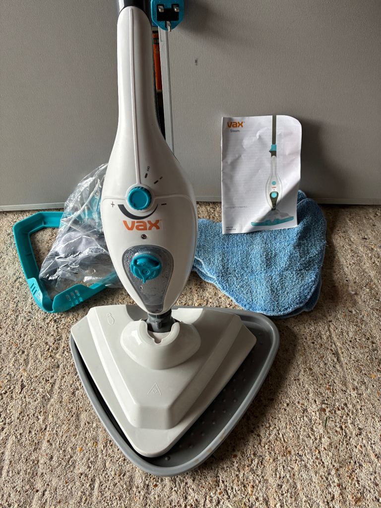Vax Steam Cleaner with accessories and manual