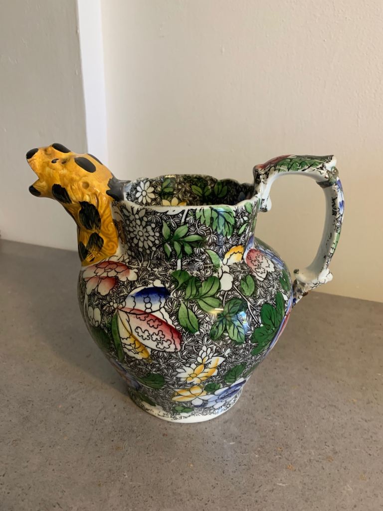 Lion head spouted antique jug