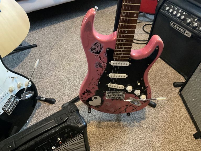Jaxville Pink Punk electric guitar with amplifier 