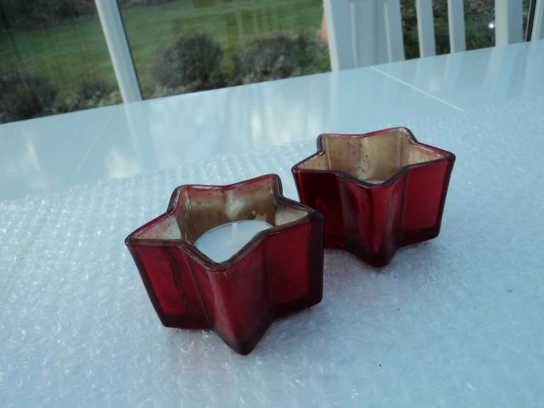 2 x red glass star shaped Christmas tea light holder.