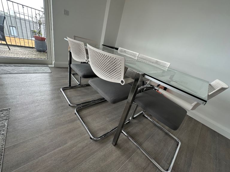 Vitra Dining Table with 4 Chairs – Glass Top, Grey Fabric Seats