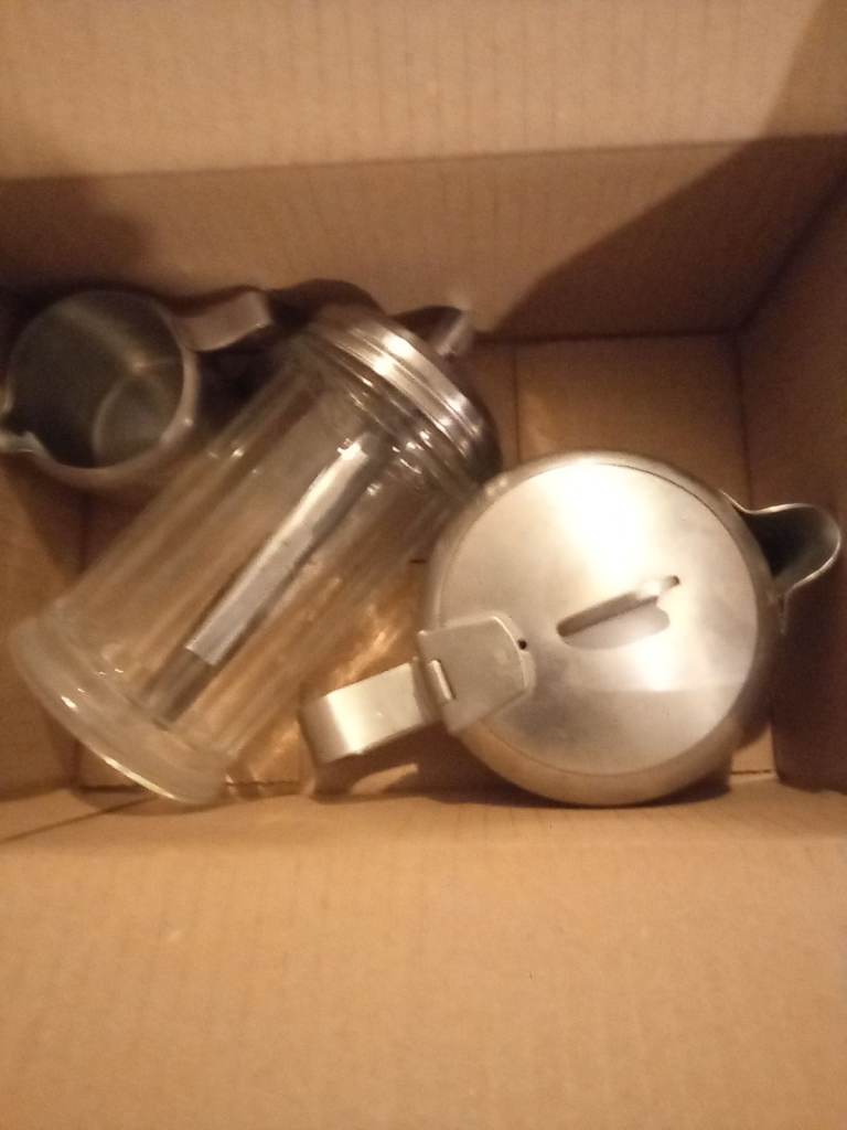 Stainless steel tea/coffee pot with milk cup and sugar decanter set.