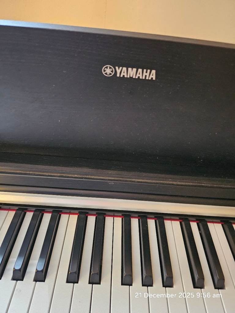Yamaha Arius YDP 142 with stool and Yamaha music book