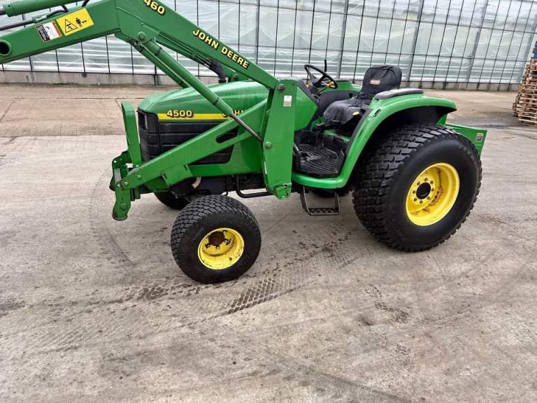 John Deere 4500 compact tractor with front end loader and bucket