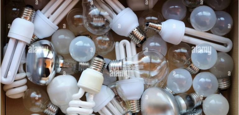 Box of many old and mixed ordinary light-bulbs