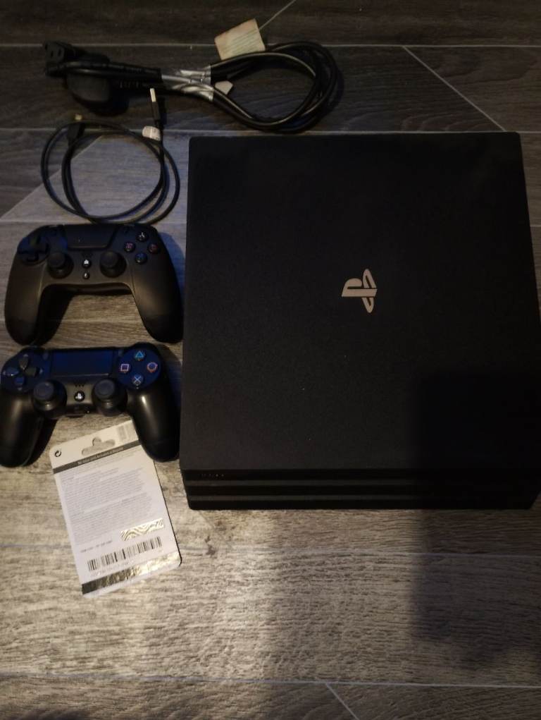 PLAYSTATION 4 PRO with GAMES 2 CONTROLLER and GIFF CARD