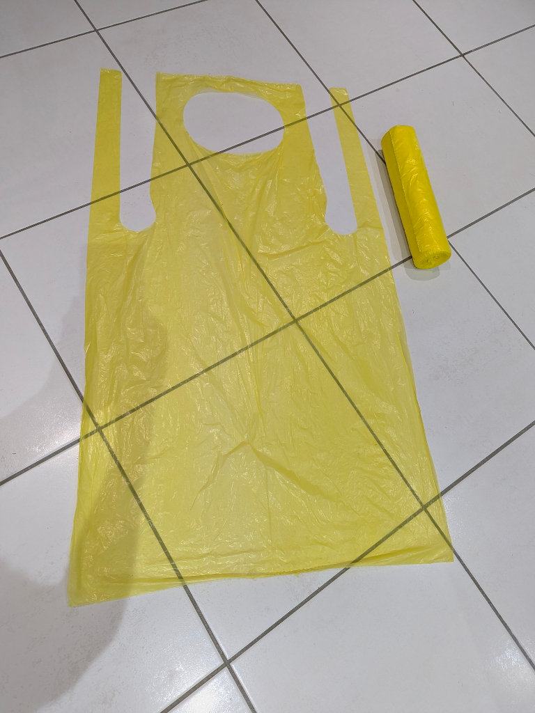 YELLOW DISPOSABLE PLASTIC POLYTHENE APRON ROLL ADULT SIZE ~100 APRONS?