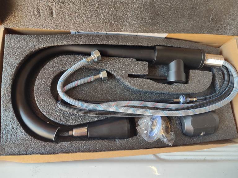 Black kitchen tap with extendable hose type head