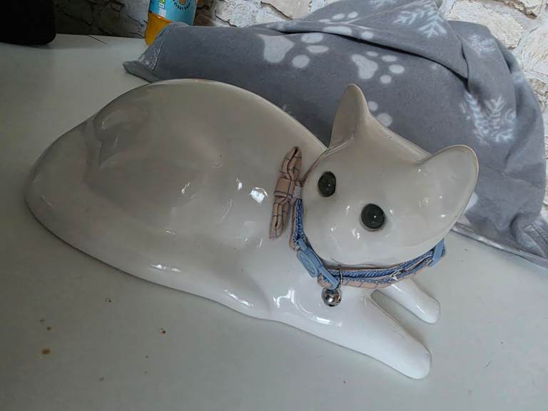White Ceramic Cat Figurine with Blue Collar and Bell